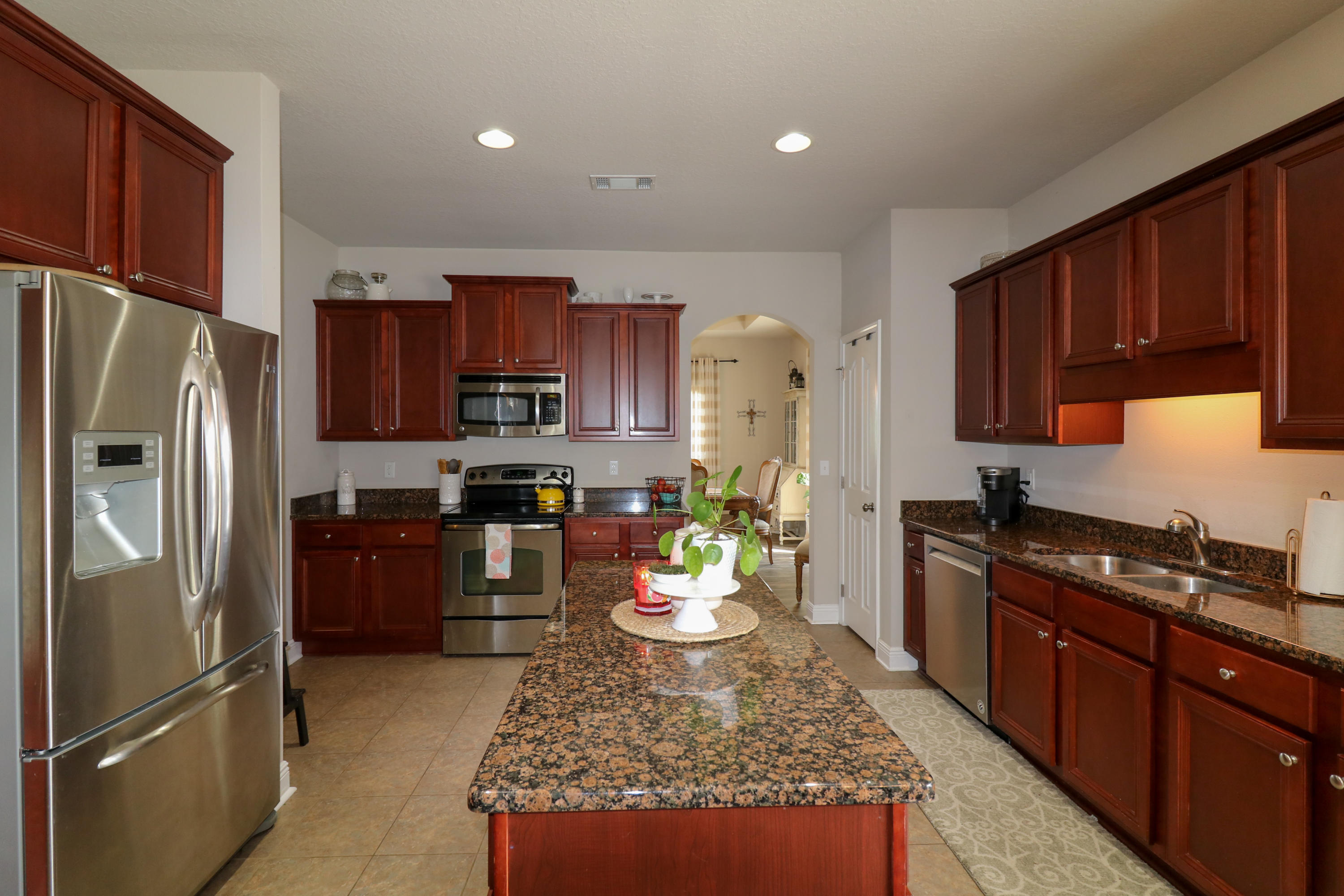 675 Red Fern Road Crestview, FL 32536 - Photo 10 of 35 a kitchen with a refrigerator sink and stove