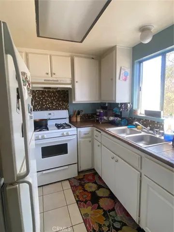 a kitchen with a stove and a sink