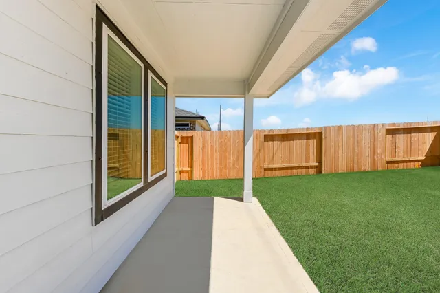 a view of backyard with tub