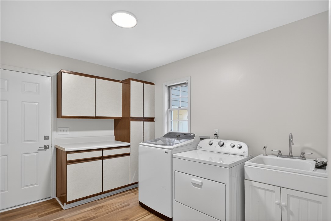 9 Lookout Lane Salem, SC 29676 - Photo 9 of 46 Functional laundry room offers a utility sink, built-in cabinetry, and modern appliances for effortless chores.