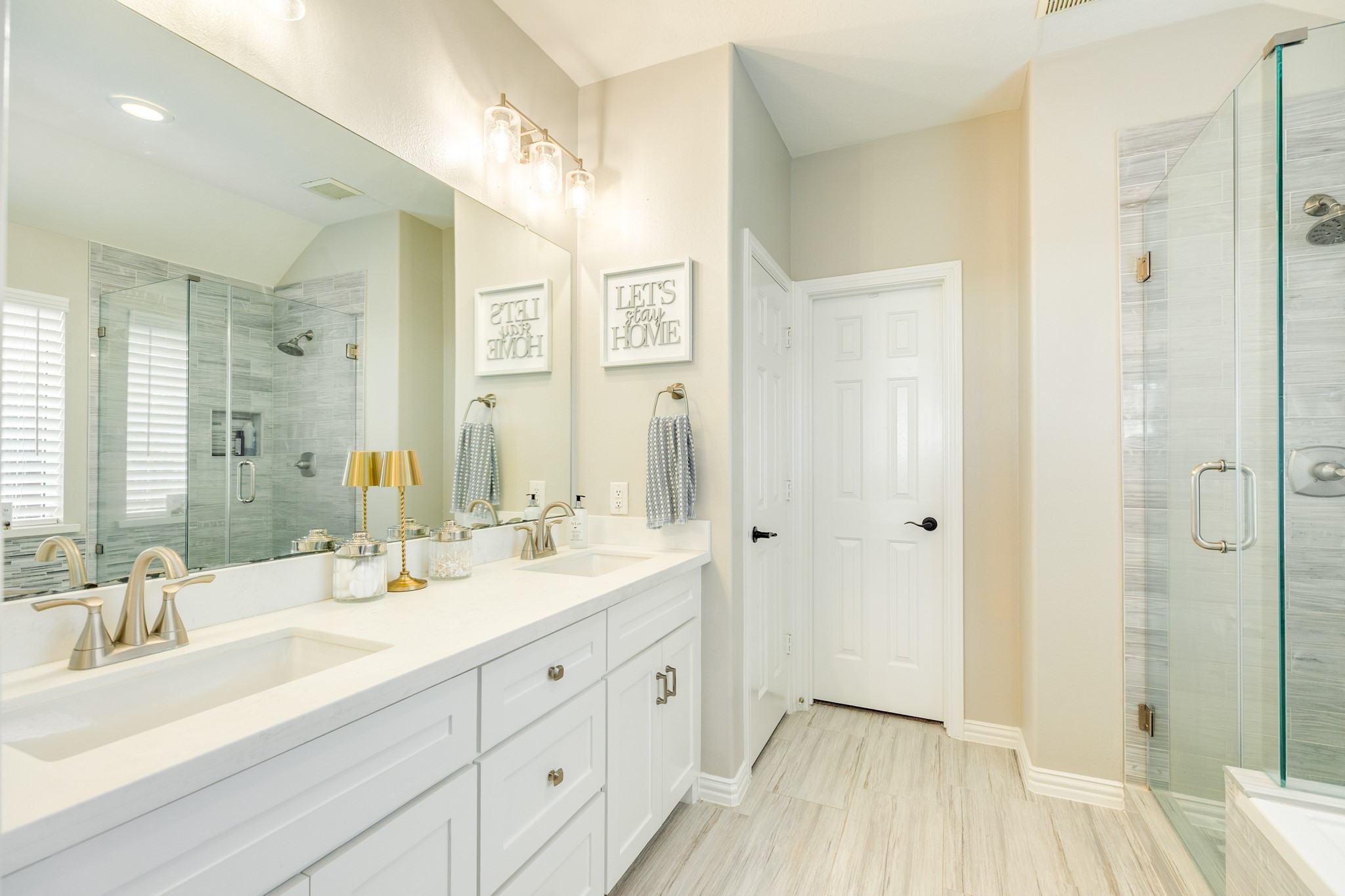 13808 Stark Bridge Lane Rosharon, TX 77583 - Photo 17 of 39 Fully renovated primary bathroom featuring premium floor-to-ceiling upgrades, including a modern, spa-inspired walk-in shower and an elegant soaking tub.