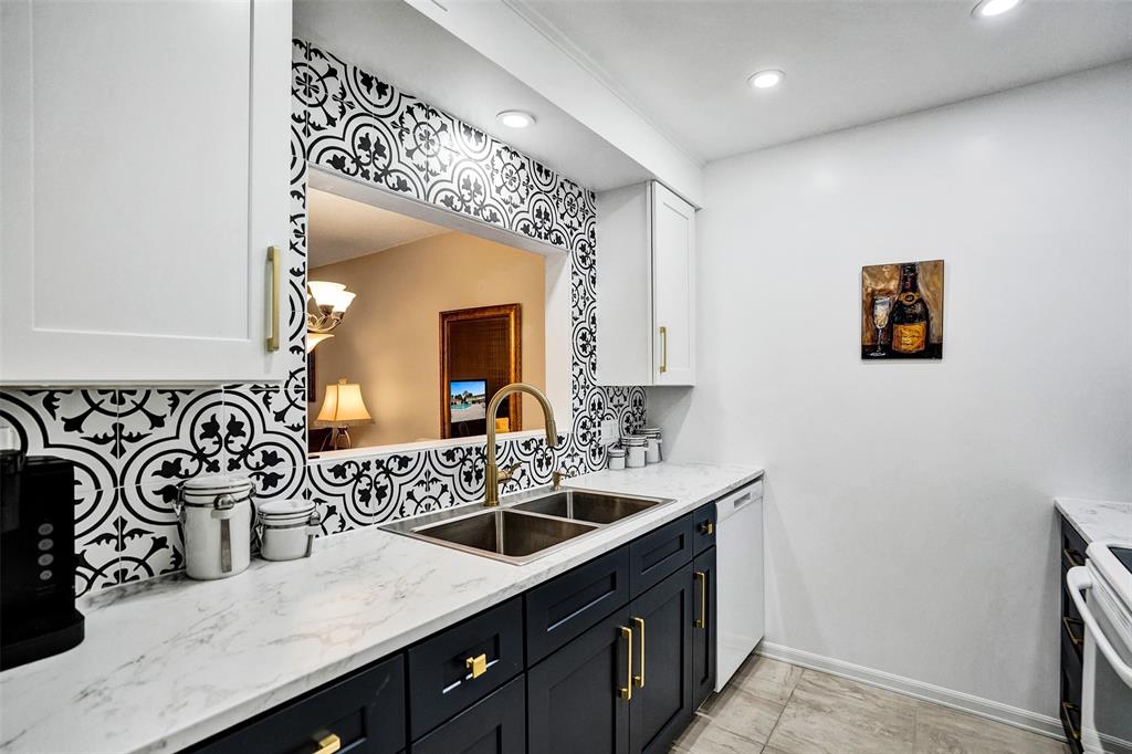 5681 Southwest 2nd Court, Unit 205 Margate, FL 33068 - Photo 1 of 37 a bathroom with a sink and a mirror