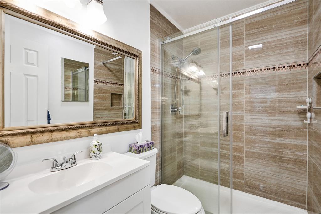 5681 Southwest 2nd Court, Unit 205 Margate, FL 33068 - Photo 17 of 37 a bathroom with a sink toilet and shower