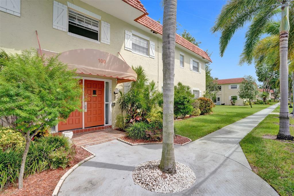 5681 Southwest 2nd Court, Unit 205 Margate, FL 33068 - Photo 31 of 37 a front view of a house with a yard