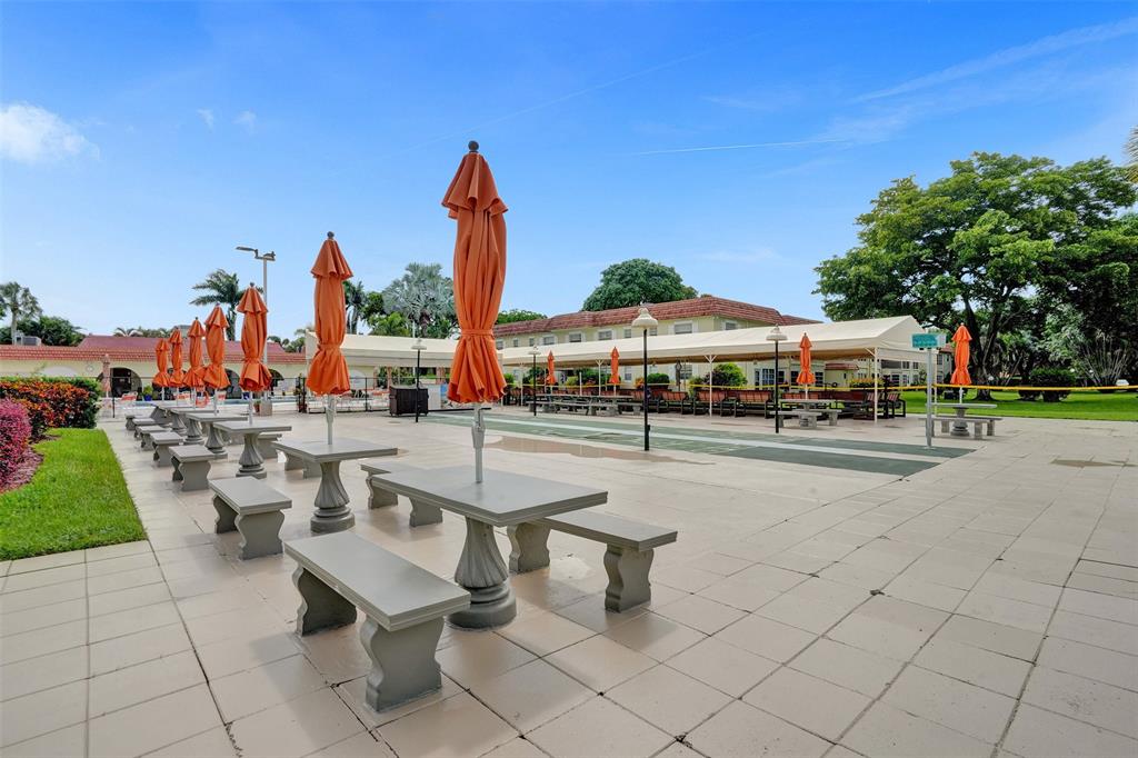 5681 Southwest 2nd Court, Unit 205 Margate, FL 33068 - Photo 35 of 37 a outdoor view with a sitting space