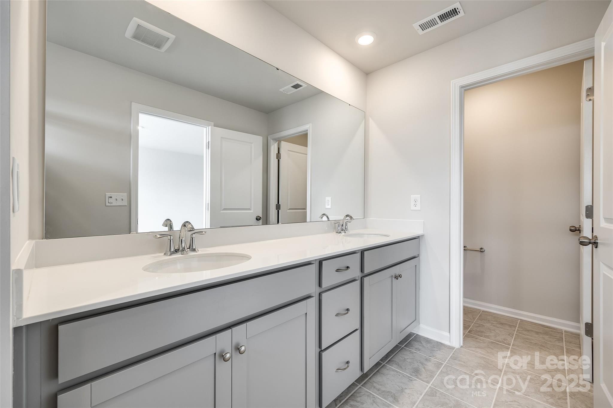 143 Morning Gap Parkway, Unit 14 Fort Mill, SC 29715 - Photo 25 of 30 a bathroom with a sink and a mirror