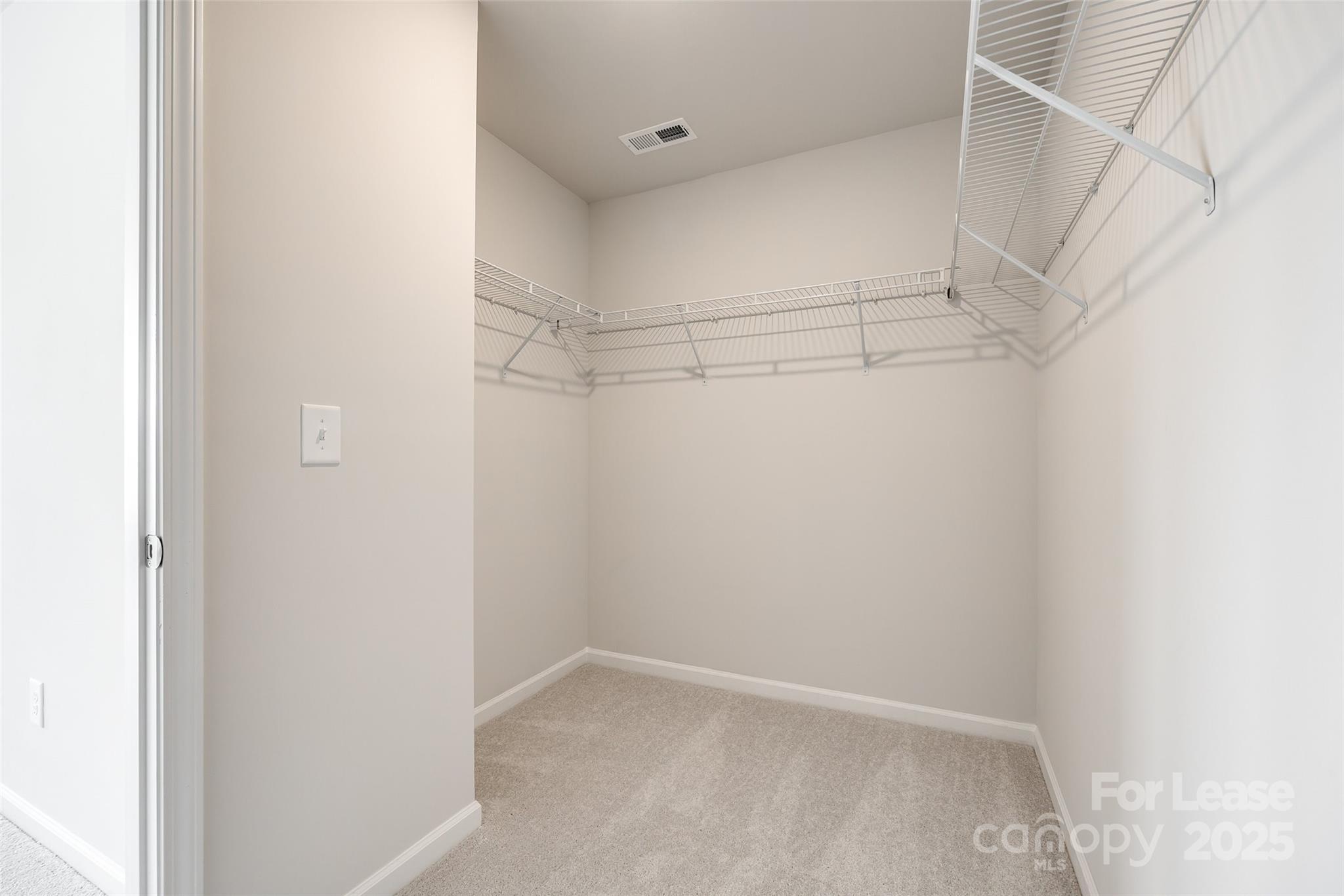 143 Morning Gap Parkway, Unit 14 Fort Mill, SC 29715 - Photo 26 of 30 a view of a room with racks on the wall