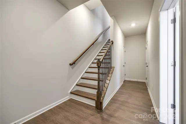 a view of a hallway with stairs
