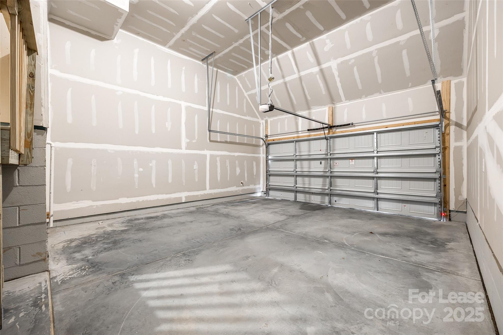 143 Morning Gap Parkway, Unit 14 Fort Mill, SC 29715 - Photo 8 of 30 a view of a garage with racks on the wall