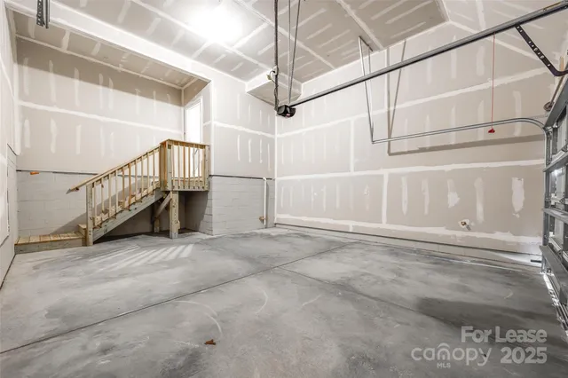 a view of an empty room with stairs