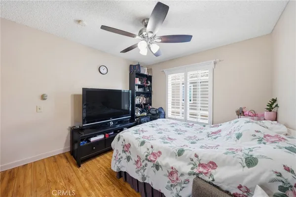 a spacious bedroom with a bed and window