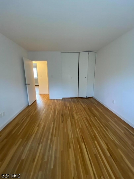 806 Morris Turnpike, Unit 2A8 Short Hills, NJ 07078 - Photo 12 of 13 a view of a room with wooden floor
