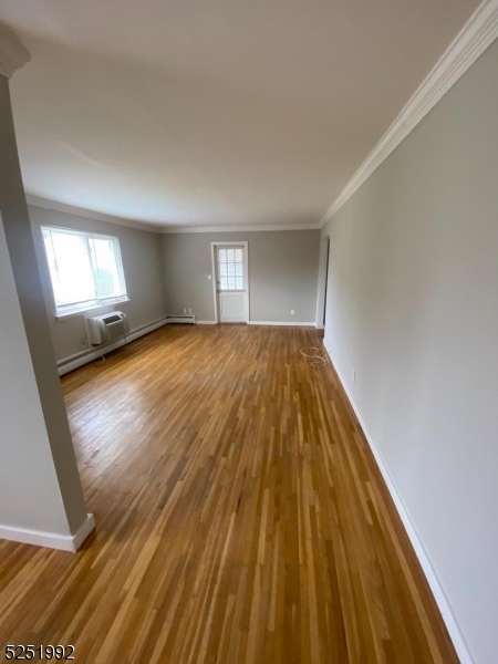 806 Morris Turnpike, Unit 2A8 Short Hills, NJ 07078 - Photo 4 of 13 a view of empty room with wooden floor