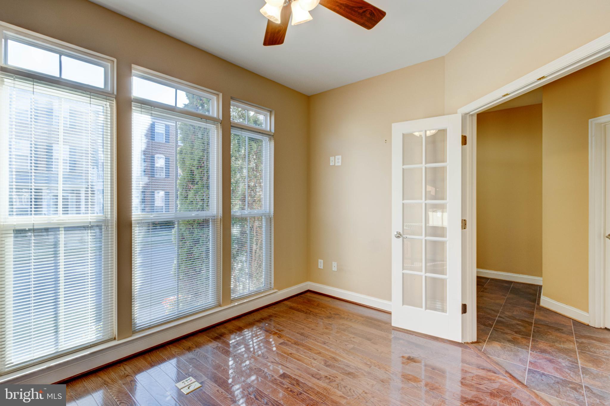 2629 Raptor Drive Odenton, MD 21113 - Photo 3 of 20 an empty room with wooden floor and windows
