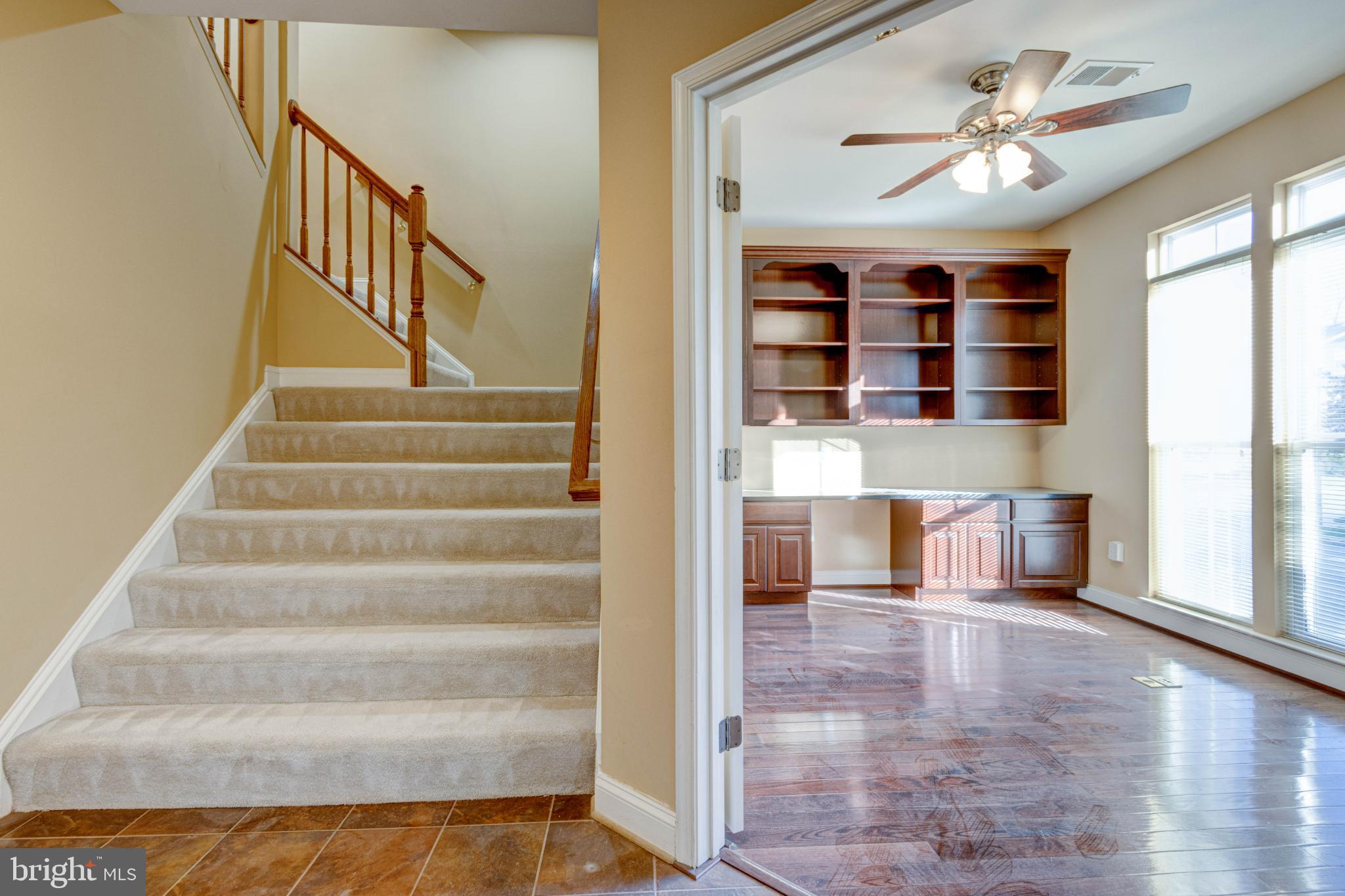 2629 Raptor Drive Odenton, MD 21113 - Photo 5 of 20 a view of staircase with a ceiling fan and a window