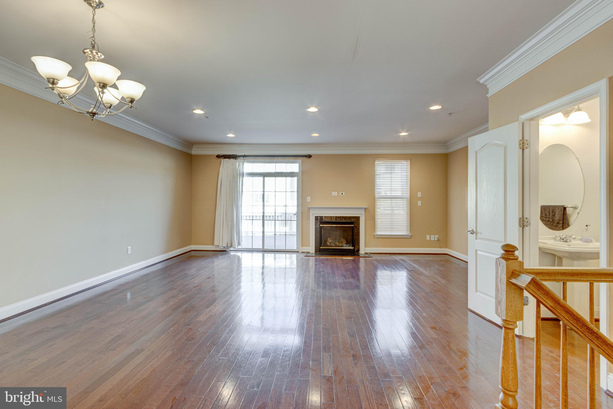2629 Raptor Drive Odenton, MD 21113 - Photo 6 of 20 a view of an empty room with wooden floor and a window