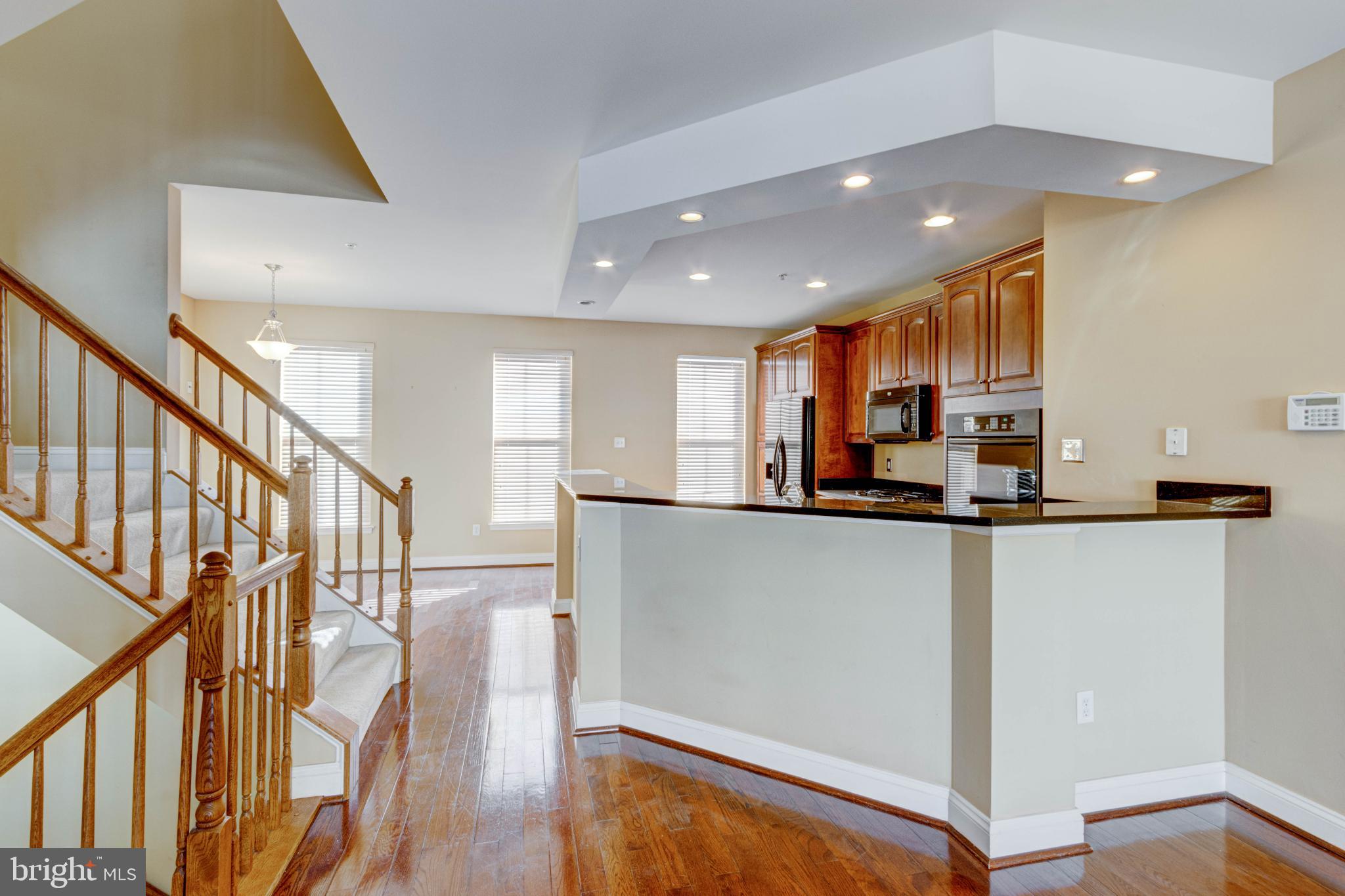 2629 Raptor Drive Odenton, MD 21113 - Photo 8 of 20 a view of kitchen with stainless steel appliances a refrigerator and wooden floor