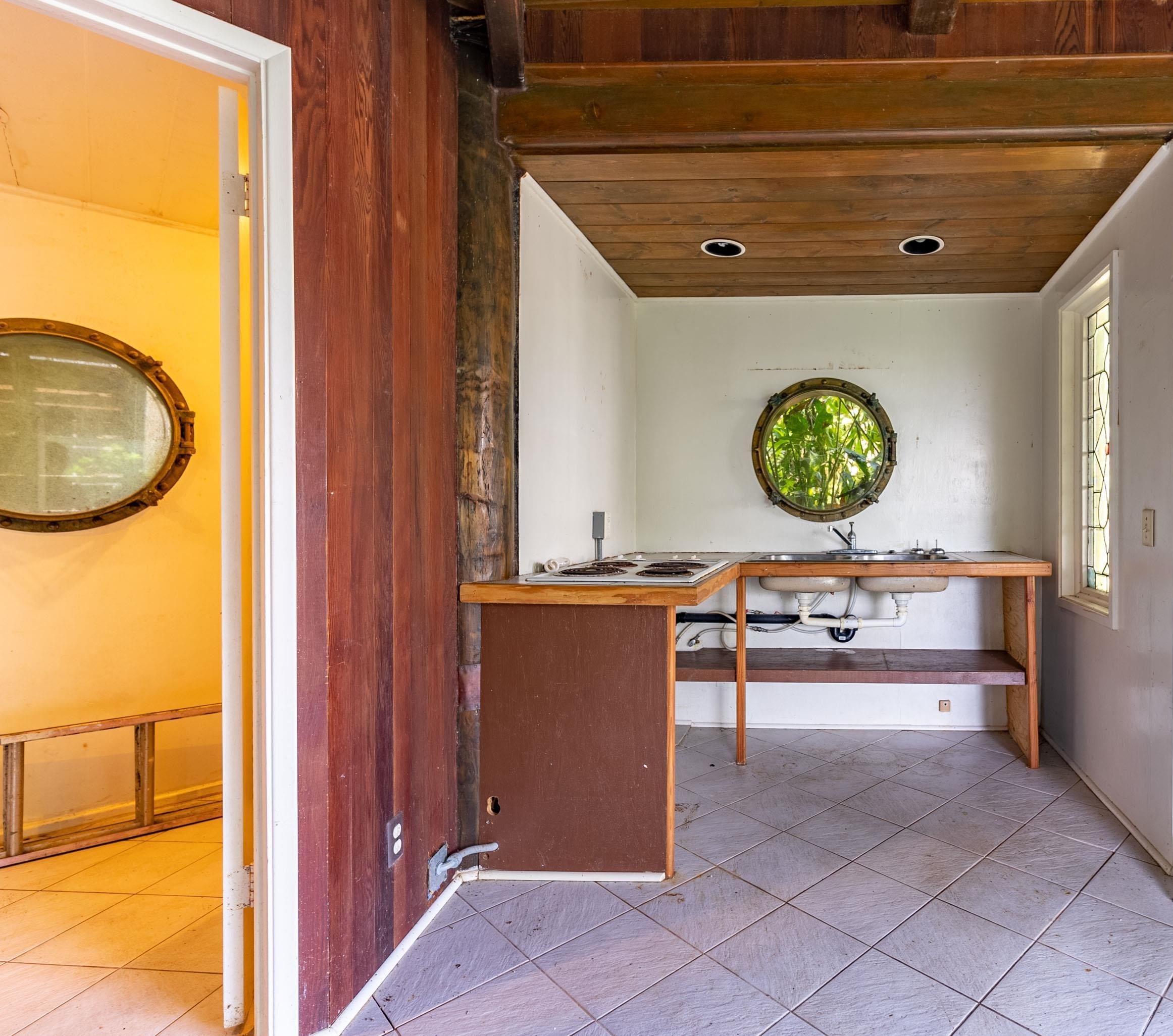 810 Nahiku Road Haiku, HI 96708 - Photo 22 of 50 a view of kitchen with a sink and a refrigerator