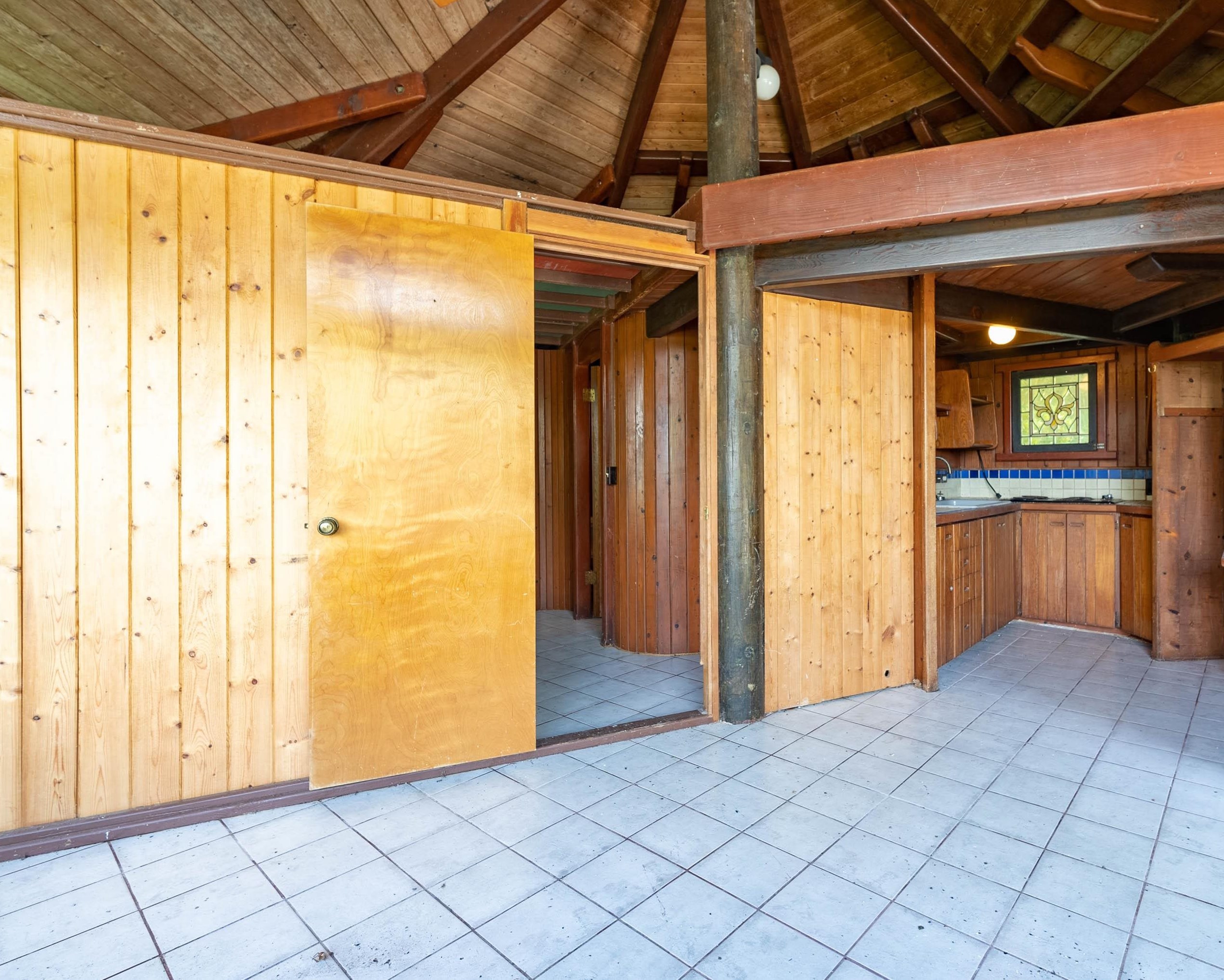 810 Nahiku Road Haiku, HI 96708 - Photo 25 of 50 a view of a hallway with wooden floor and cabinet