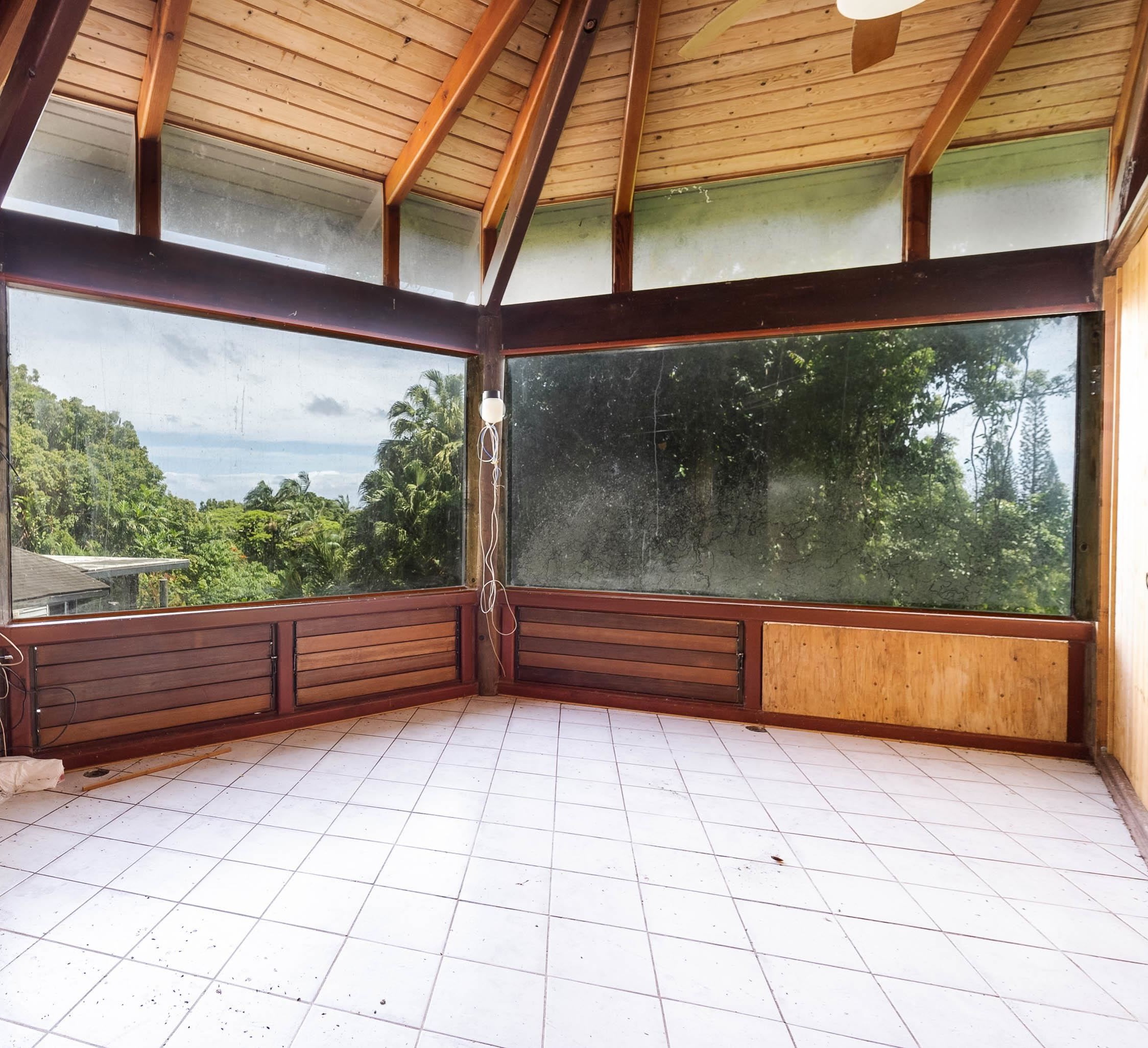 810 Nahiku Road Haiku, HI 96708 - Photo 26 of 50 a sitting area with wooden walls