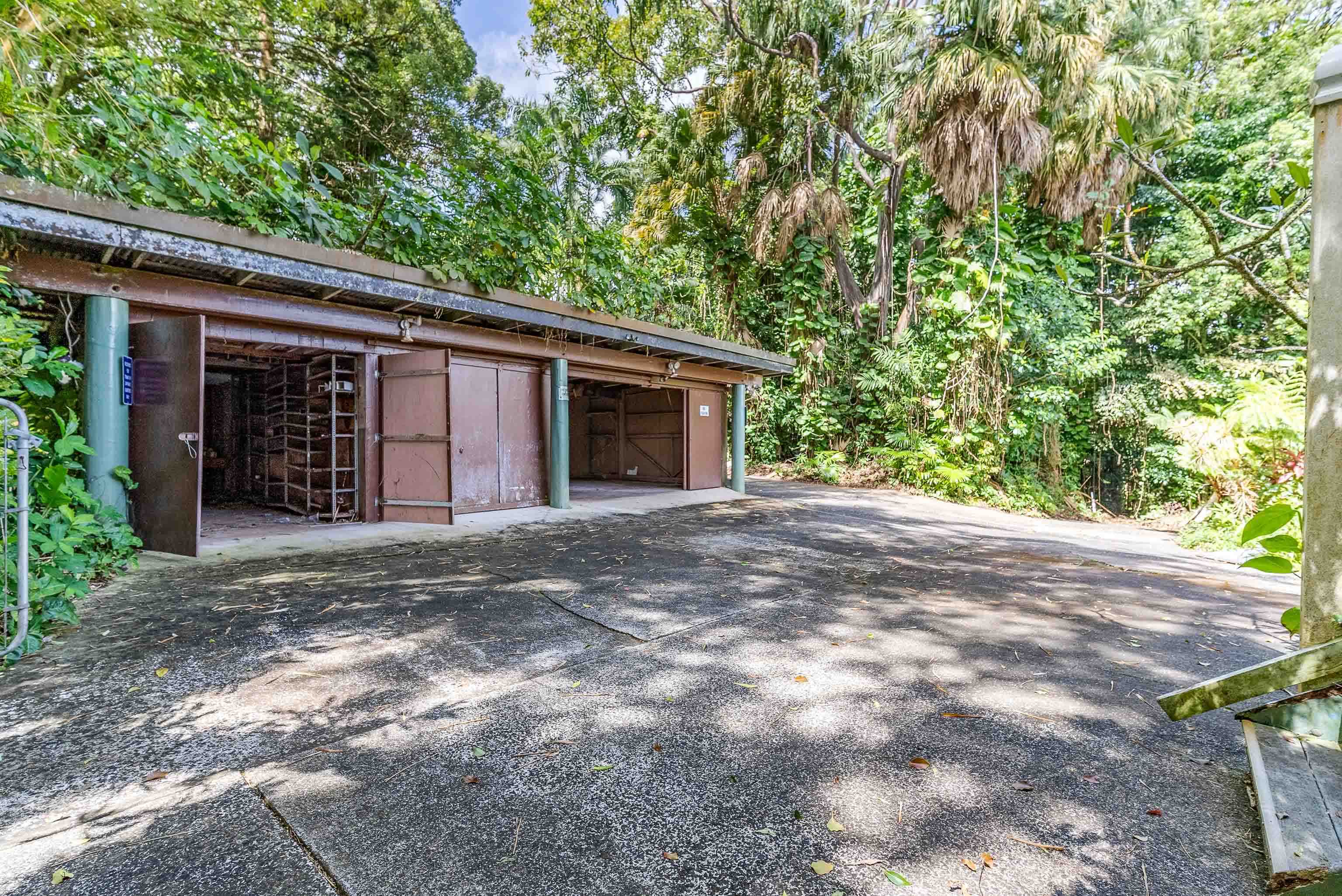 810 Nahiku Road Haiku, HI 96708 - Photo 45 of 50 a front view of a house with a garden and yard