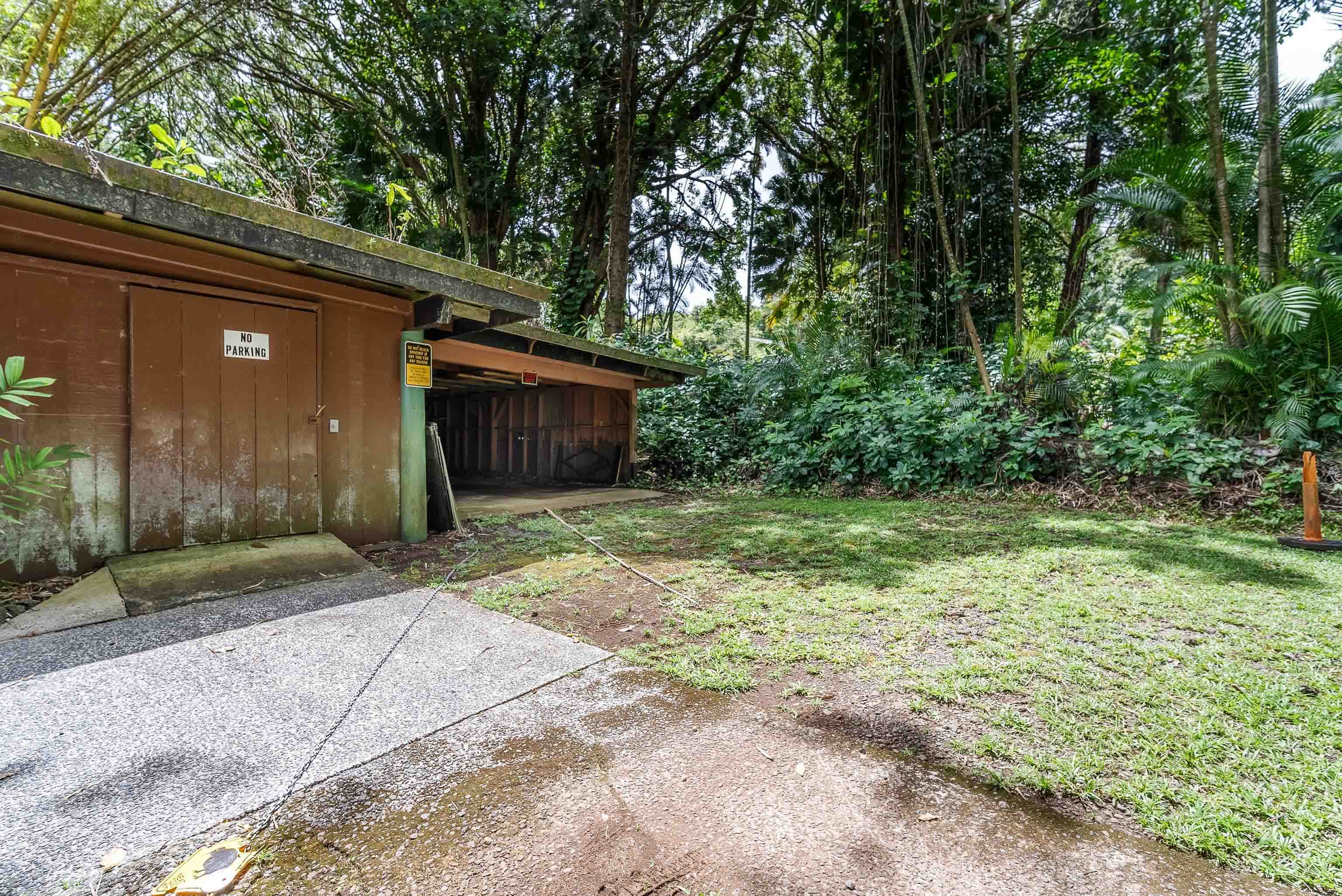 810 Nahiku Road Haiku, HI 96708 - Photo 47 of 50 a house with trees in front of it