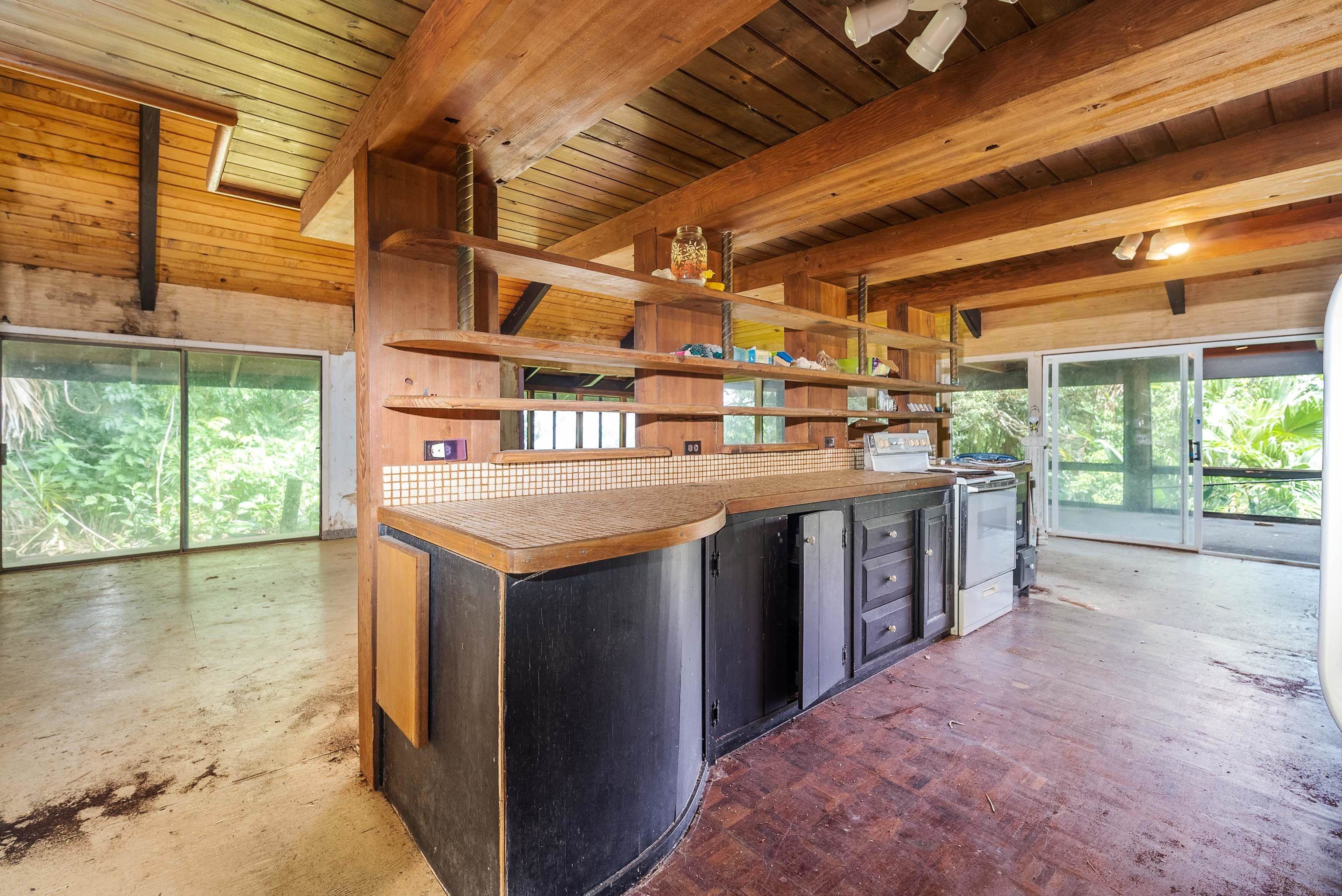 810 Nahiku Road Haiku, HI 96708 - Photo 10 of 50 a kitchen with a stove and a sink