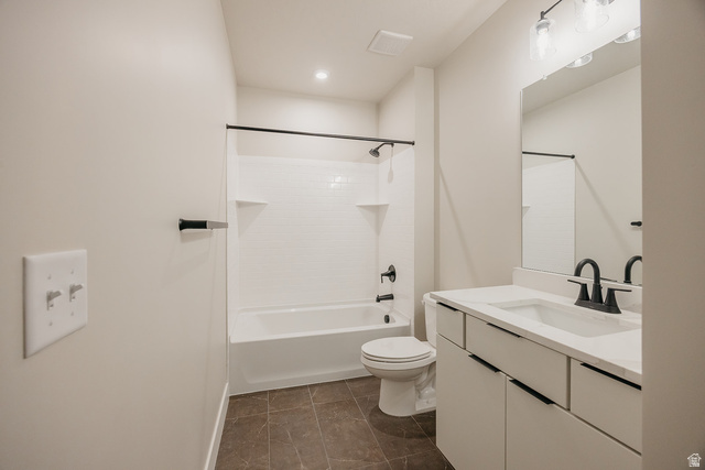 5910 Canyon Rim Road, Unit 619 Lehi, UT 84048 - Photo 52 of 52 Bathroom featuring a white vanity with integrated sink, modern black fixtures, subway tile bath surround, and recessed lighting