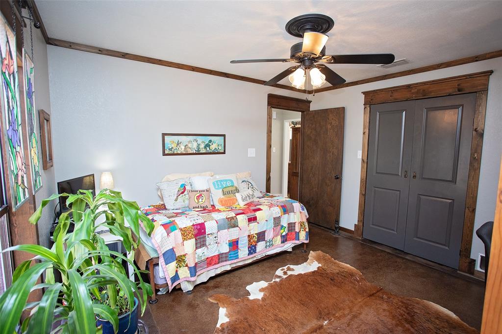 1250 Canyon Road Graham, TX 76450 - Photo 12 of 40 a bedroom with a bed table and a window