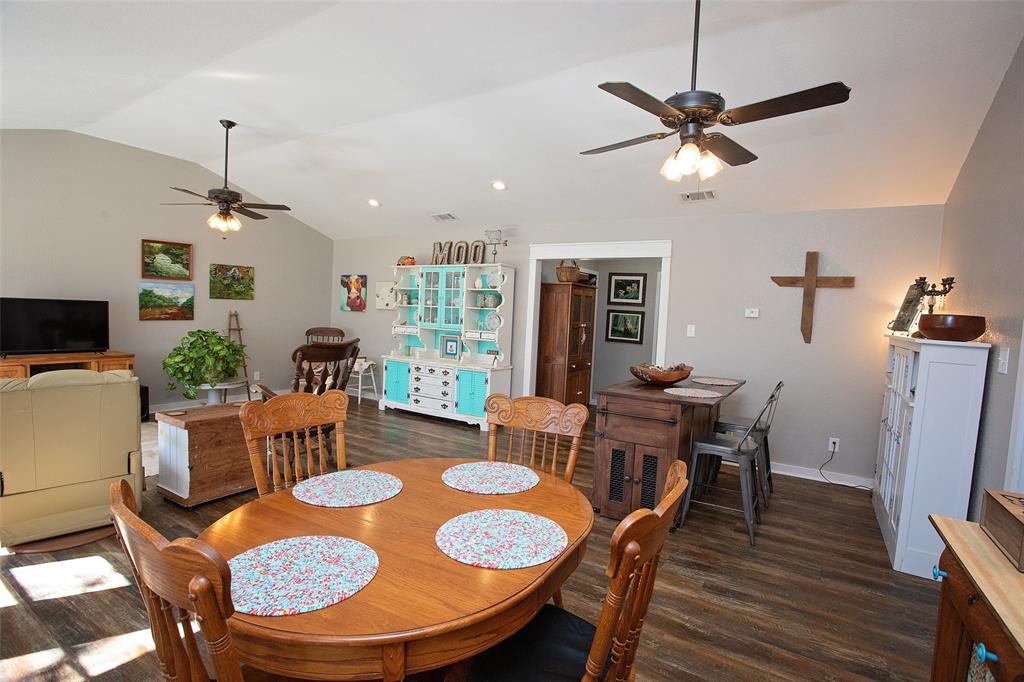 1250 Canyon Road Graham, TX 76450 - Photo 14 of 40 a view of a dining room with furniture window and wooden floor