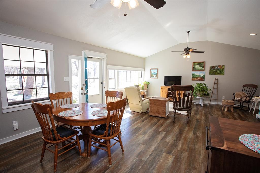 1250 Canyon Road Graham, TX 76450 - Photo 15 of 40 a view of a dining room with furniture window and wooden floor