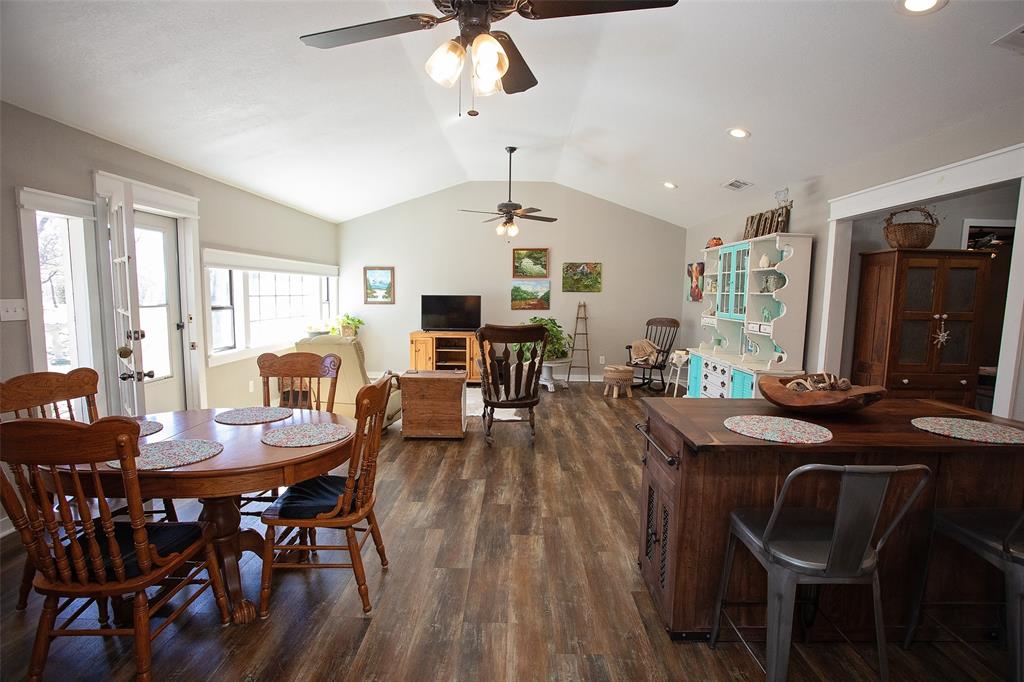 1250 Canyon Road Graham, TX 76450 - Photo 16 of 40 a view of a dining room with furniture and wooden floor