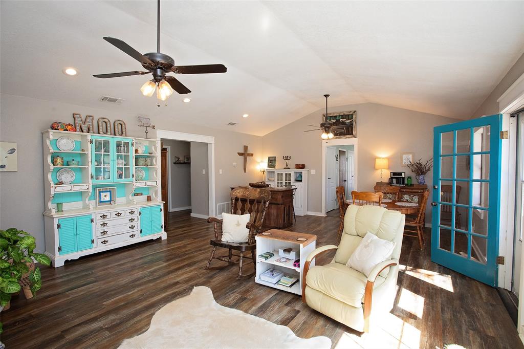 1250 Canyon Road Graham, TX 76450 - Photo 18 of 40 a living room with furniture and a chandelier