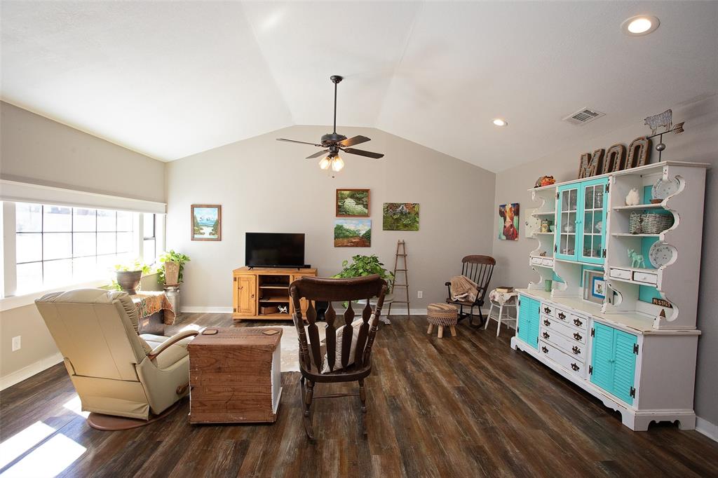 1250 Canyon Road Graham, TX 76450 - Photo 19 of 40 a living room with furniture and a flat screen tv