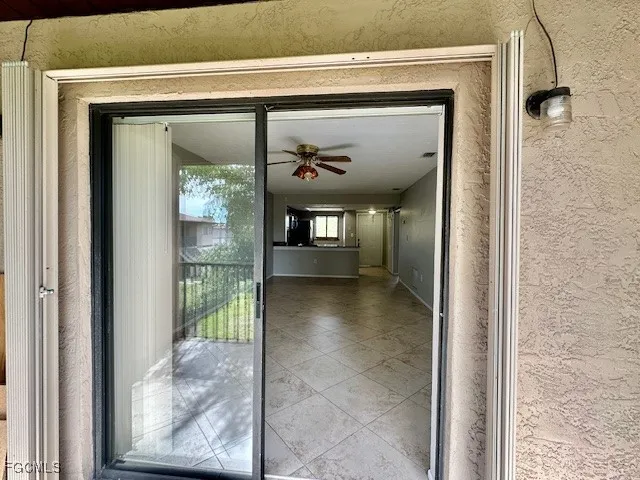 a view of a hallway with wooden shelves