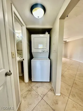 a view of a storage & utility room with a sink