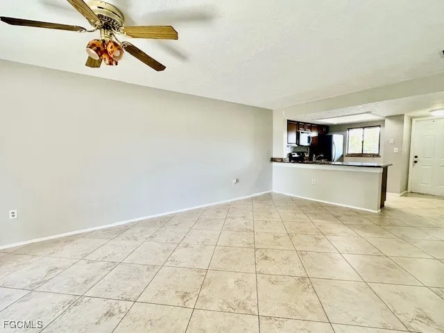 a view of a kitchen with a sink and cabinets