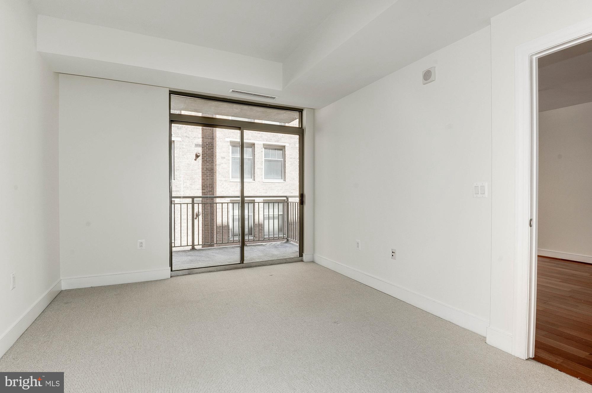 2425 L Street Northwest, Unit 434 Washington, DC 20037 - Photo 15 of 37 Master suite leads to private balcony