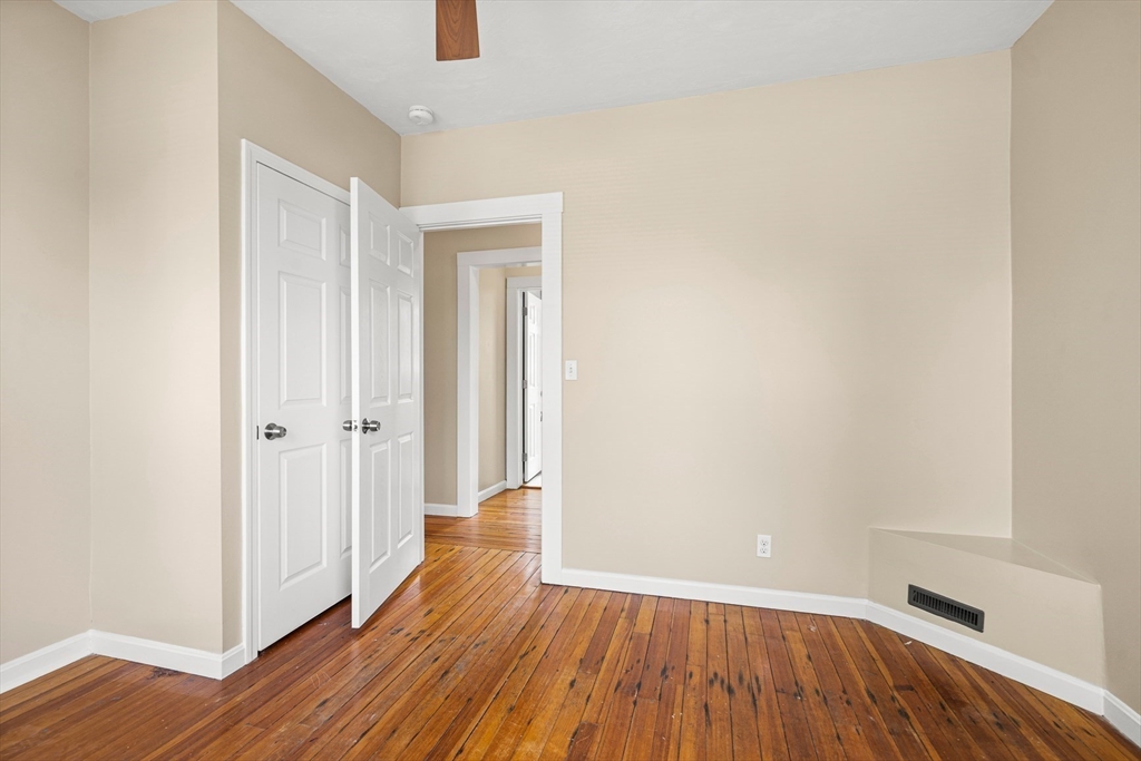 18 St Clair Street, Unit 3 Lynn, MA 01902 - Photo 16 of 36 a view of a hallway with wooden floor and closet