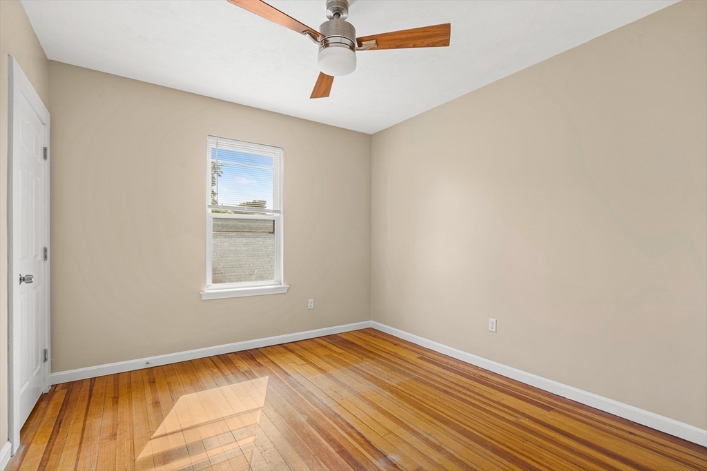 18 St Clair Street, Unit 3 Lynn, MA 01902 - Photo 19 of 36 a view of a room with wooden floor and cabinet