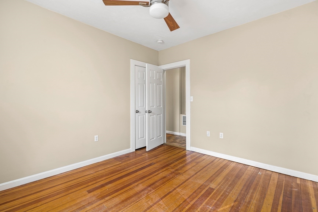 18 St Clair Street, Unit 3 Lynn, MA 01902 - Photo 20 of 36 wooden floor in an empty room