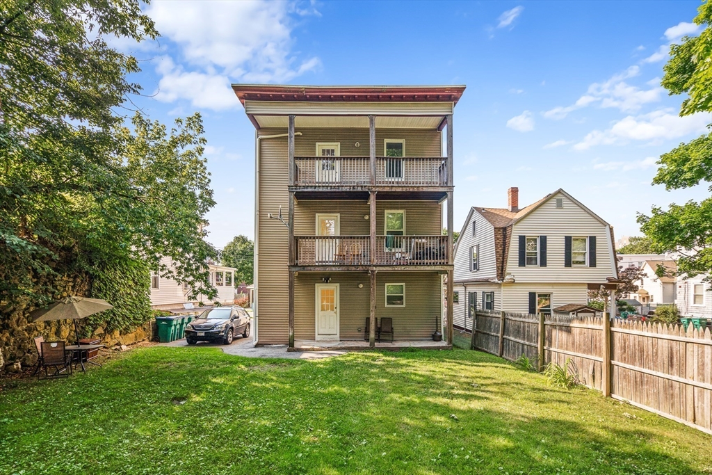 18 St Clair Street, Unit 3 Lynn, MA 01902 - Photo 2 of 36 a front view of a house with a yard