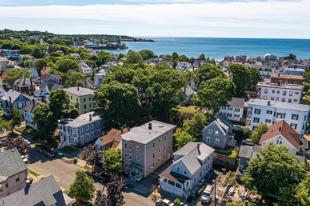 18 St Clair Street, Unit 3 Lynn, MA 01902 - Photo 33 of 36 an aerial view of a house with a yard swimming pool and outdoor seating