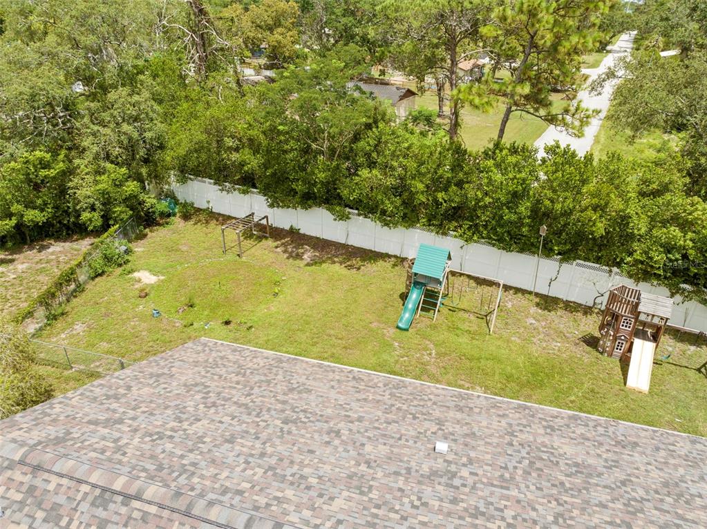 7492 Aloe Drive Spring Hill, FL 34607 - Photo 11 of 57 a view of a swimming pool with an outdoor space