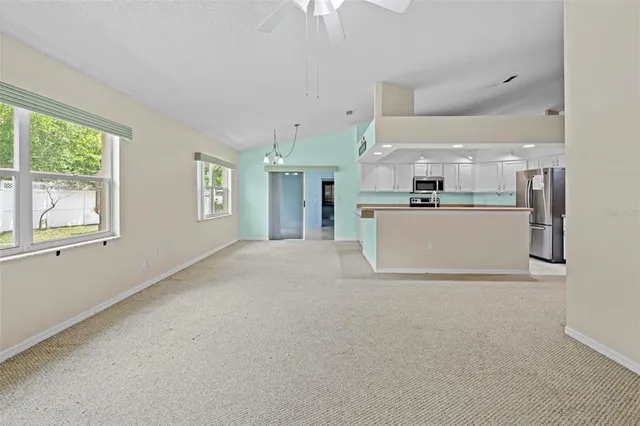 an aerial view of a house with a swimming pool