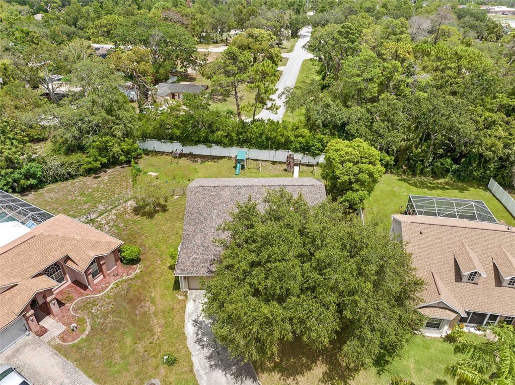 7492 Aloe Drive Spring Hill, FL 34607 - Photo 23 of 57 an aerial view of a house with a swimming pool