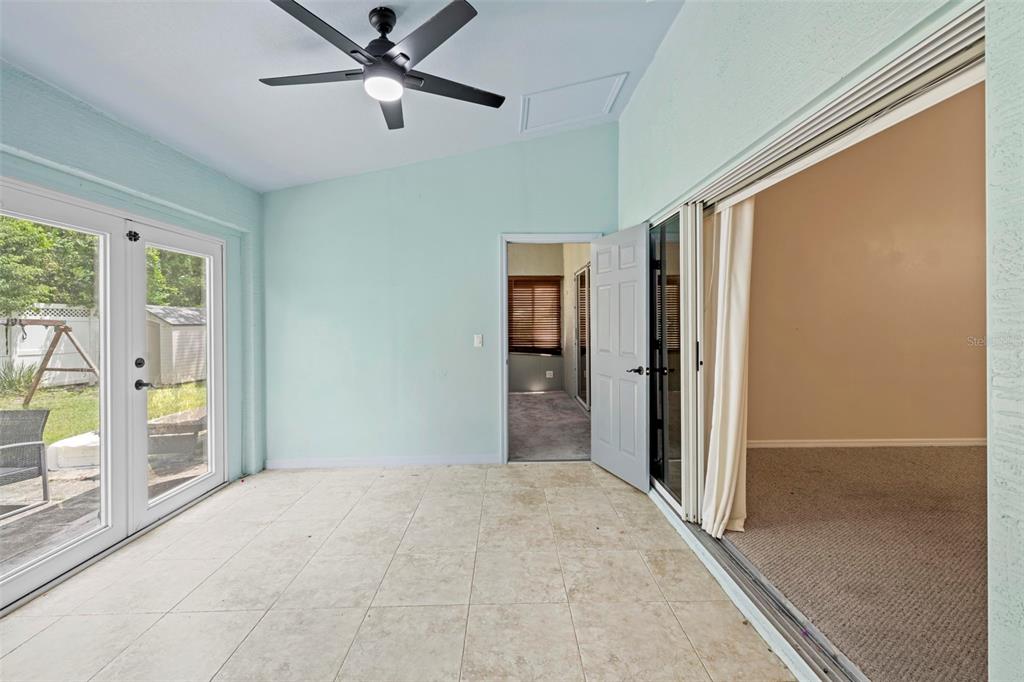 7492 Aloe Drive Spring Hill, FL 34607 - Photo 24 of 57 a view of hallway with a ceiling fan