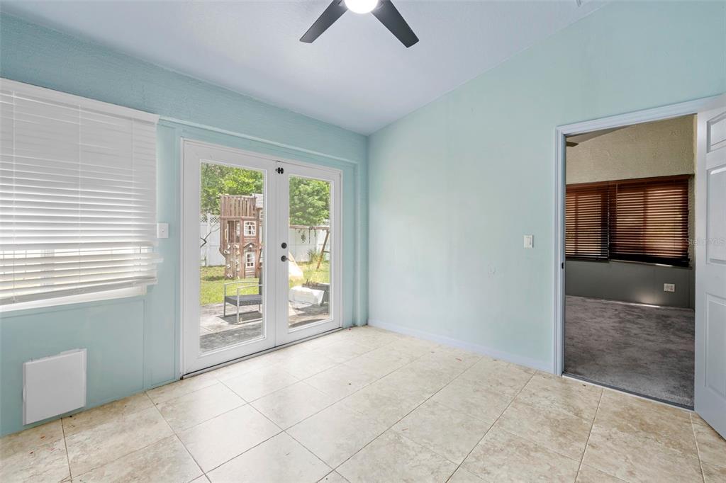 7492 Aloe Drive Spring Hill, FL 34607 - Photo 25 of 57 an empty room with windows and closet
