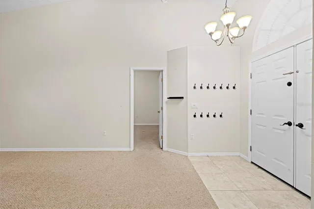 a utility room with cabinets washer and dryer