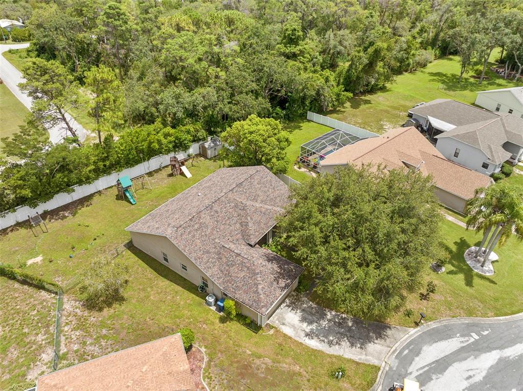 7492 Aloe Drive Spring Hill, FL 34607 - Photo 35 of 57 a view of a yard with an outdoor space